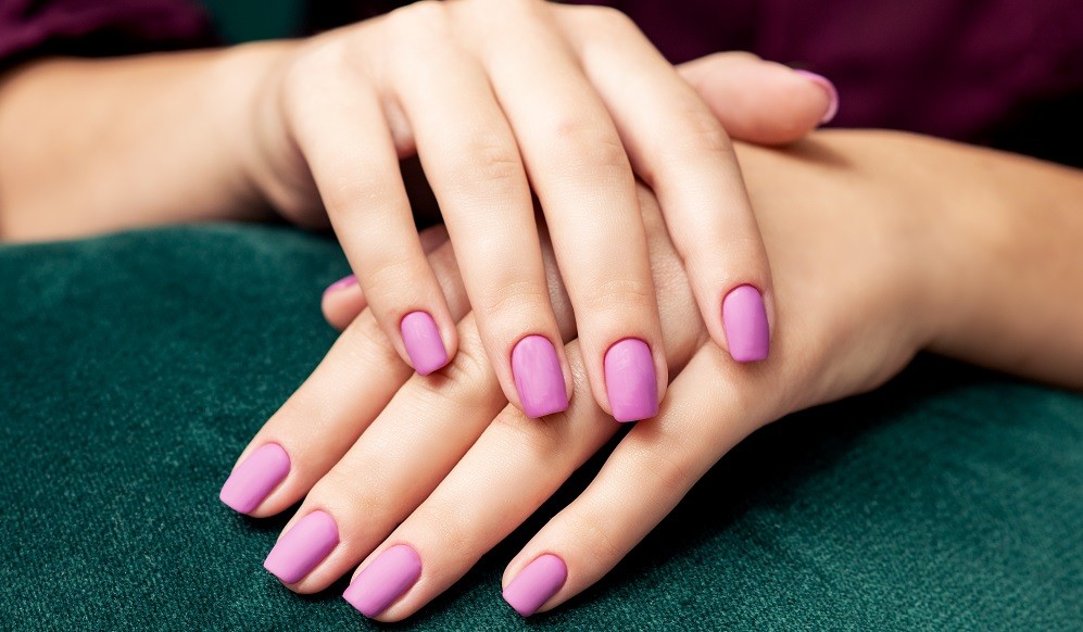 Perfect fashion stylish purple matte manicure.